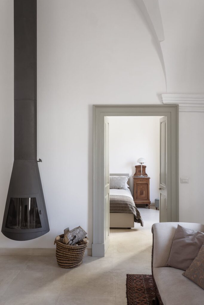 10. Angelo_Custode_Nardòsalento_Credits40Mirrors_28_Living room & fireplace Living room with suspended fireplace and view into the bedroom, Angelo Custode, Nardò