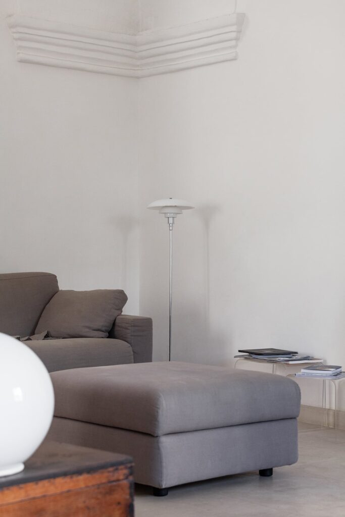 12. Angelo_Custode_Nardòsalento_Credits40Mirrors_46_Living room detail Living room corner with floor lamp and grey sofa, Angelo Custode, Nardò