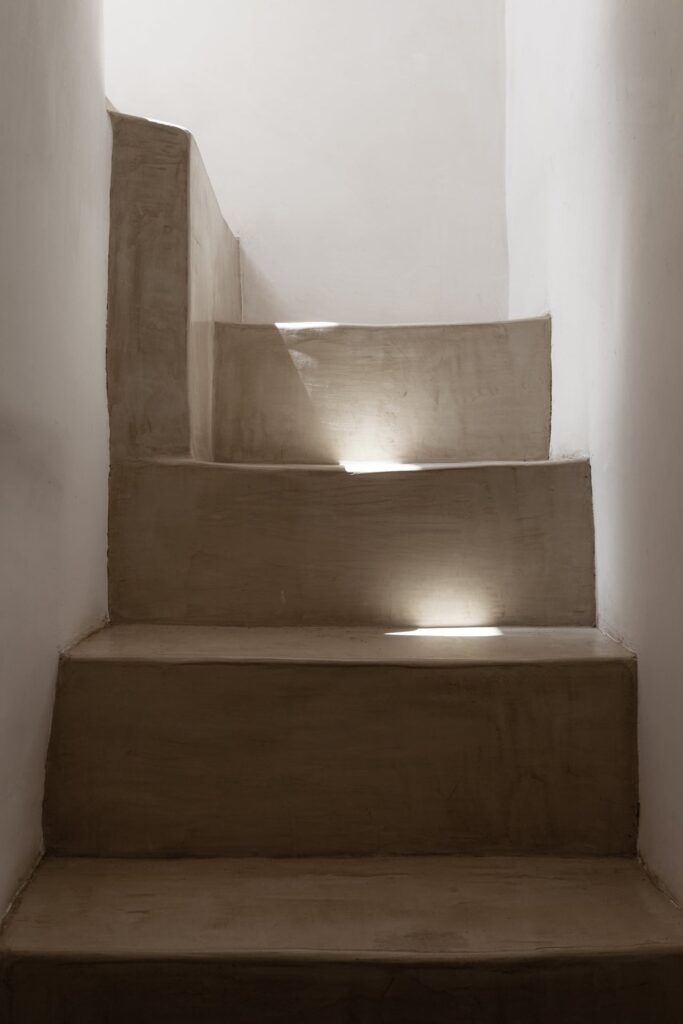 Stone staircase with recessed lighting leading to the rooftop, La Botte, Nardò