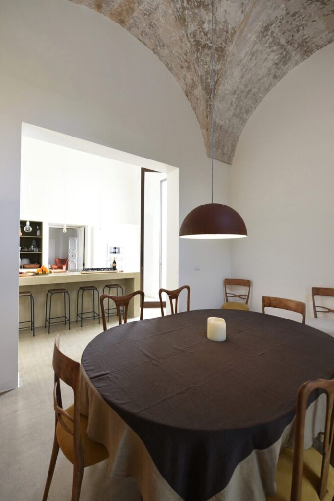 15. La Corte - NardòSalento - VERTICAL - Credit Elizabeth Rubino_DSC_6128_dining room Dining room with dome pendant light and vaulted stone ceiling, La Casa Grande, Nardò