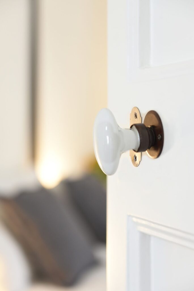 Porcelain door handle detail leading into the master bedroom, La Corte, Nardò