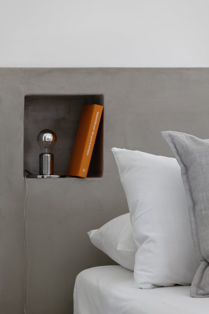 Bedroom 2 headboard detail with a garden-facing window, Agrumeto house, Nardò