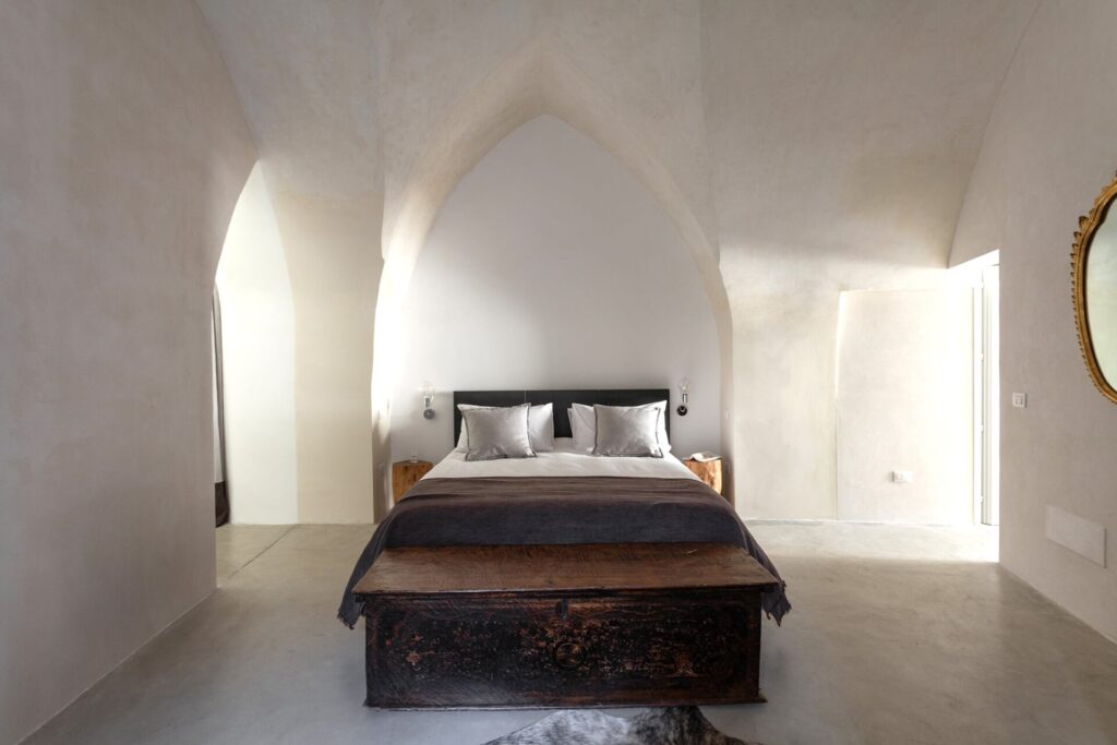 20. Agrumeto_Nardòsalento_Credits40Mirrors_3091_bedroom 1 Bedroom with dramatic vaulted ceiling and a fur throw, La Casa Grande, Nardò