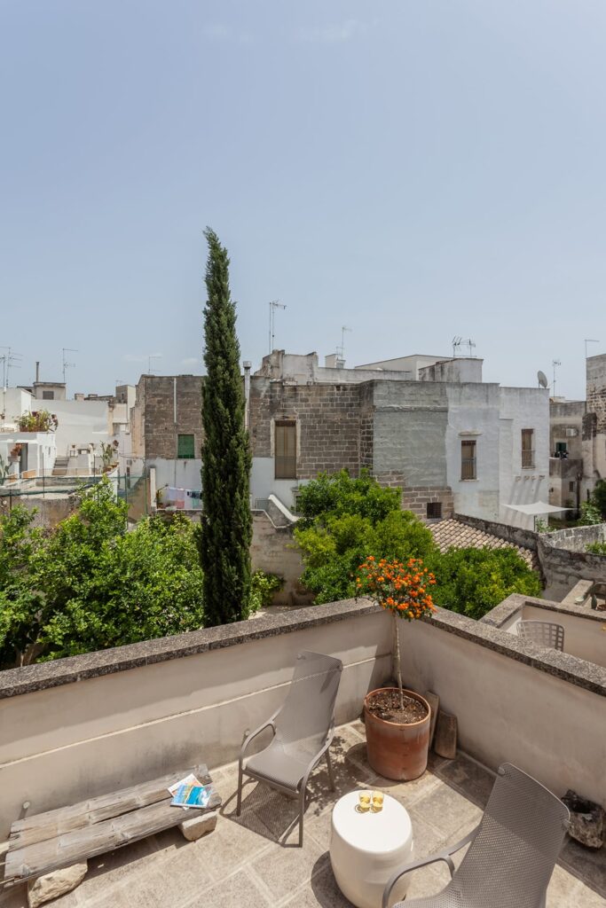 Rooftop terrace with a cypress tree and view over Nardò's rooftops, Agrumeto house