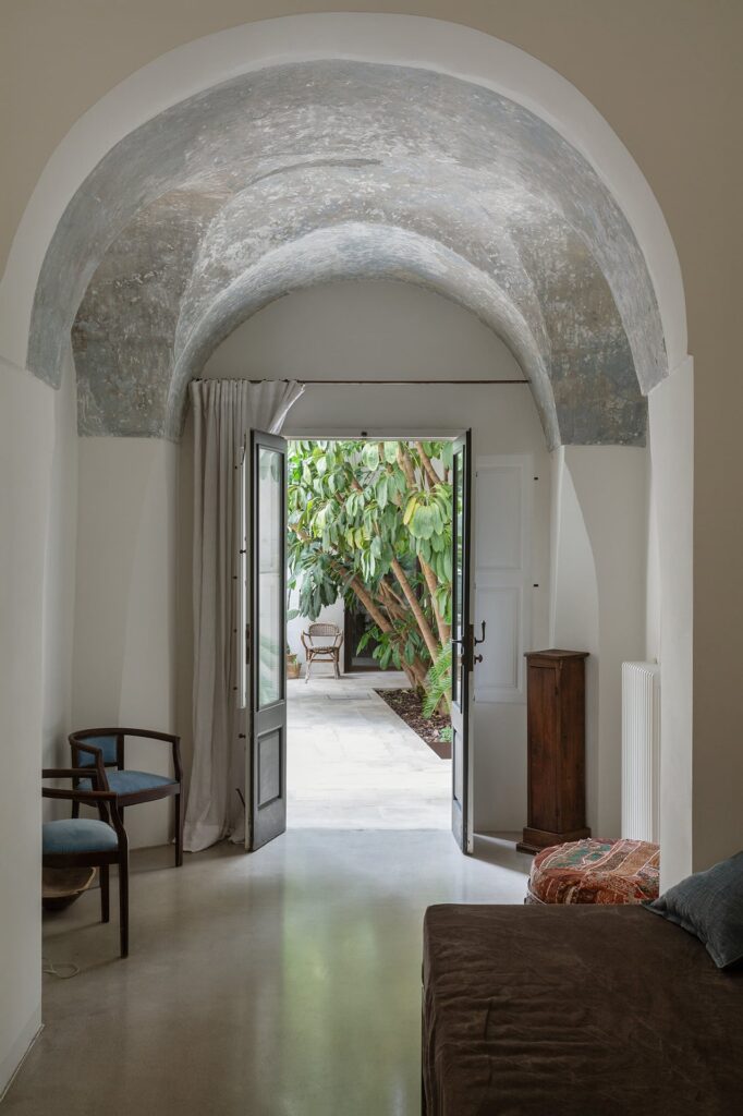 Bedroom 4 with a view through the archway to the courtyard, La Corte, Nardò