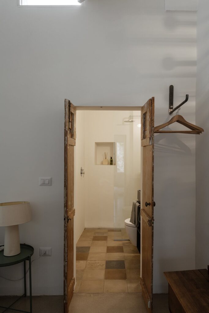 Bedroom 4 rustic doors opening onto the ensuite bathroom, La Corte, Nardò