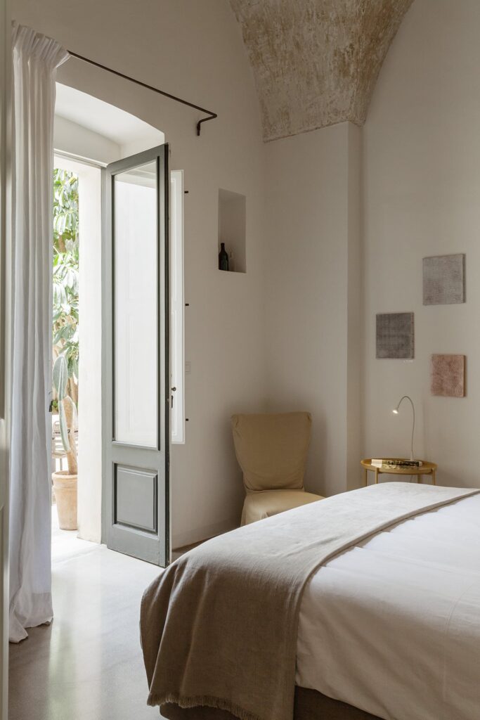 Bedroom 2 with French doors open to the courtyard, La Corte palazzo, Nardò