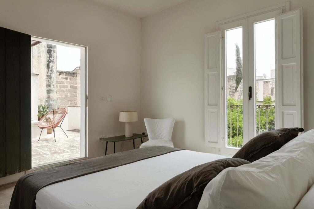 Bedroom 3 with a private terrace and view of cypress trees, La Corte, Nardò