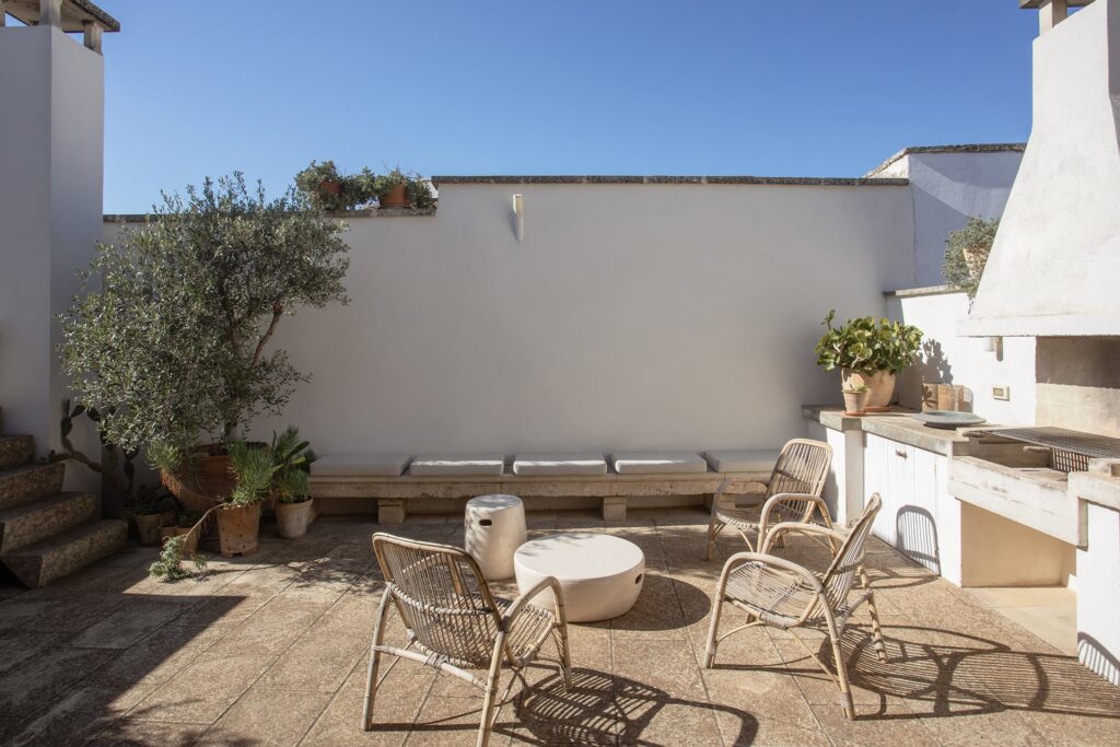 7. Angelo_Custode_Nardòsalento_Credits40Mirrors_65Intermediate terrace and terrace shed and summer kitchen Terrace summer kitchen beneath an olive tree, Angelo Custode, Nardò