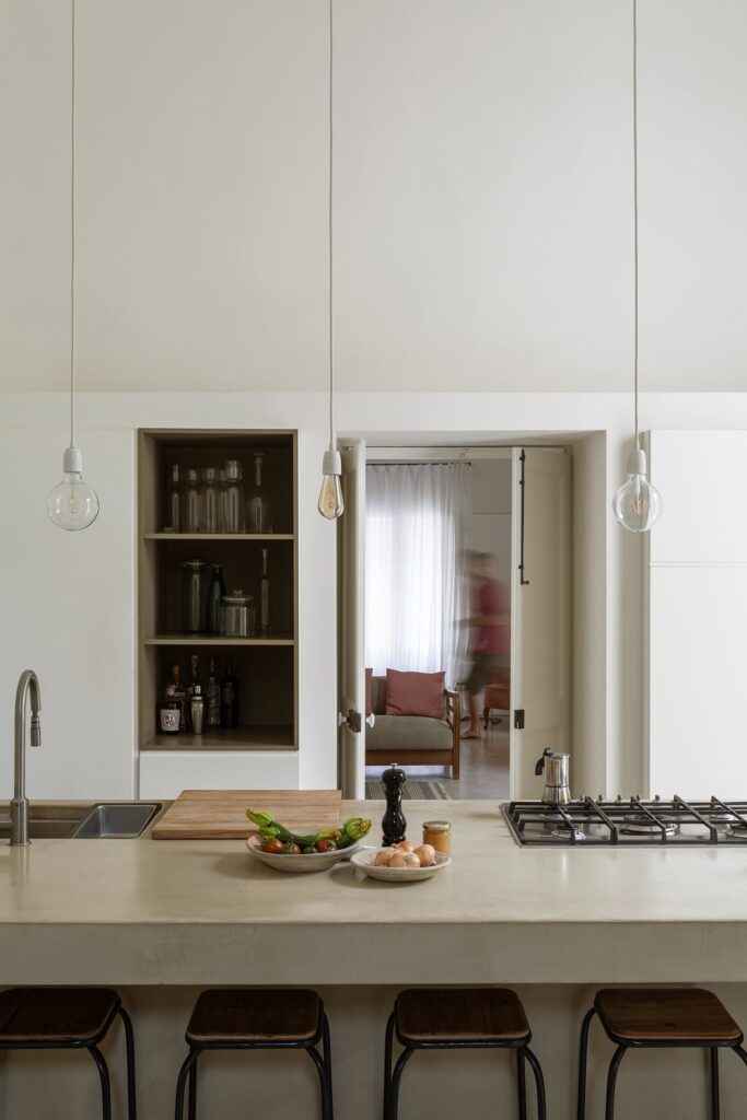 Kitchen with pendant bulbs and open shelving, La Corte palazzo, Nardò